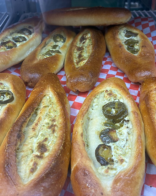 Fresh khachapuri and specialty breads at Corleone Pizza